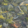 a close up of rocks under water